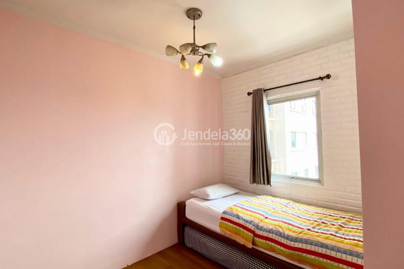 Bedroom 2 Affordable 3BR Apartment Middle Floor with Pool View at Gading Mediterania Residence