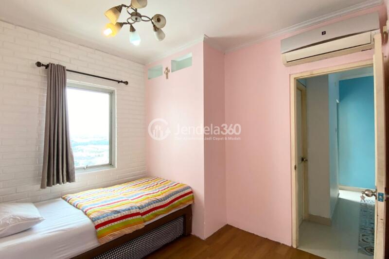 Bedroom 2 Affordable 3BR Apartment Middle Floor with Pool View at Gading Mediterania Residence