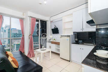 Living Room 2BR Apartment with City View at Tifolia Apartment