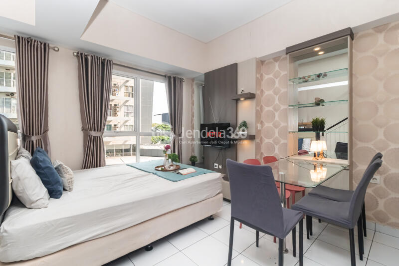 Living Room Peaceful 2BR Apartment Low Floor with city View at Casa De Parco Apartment