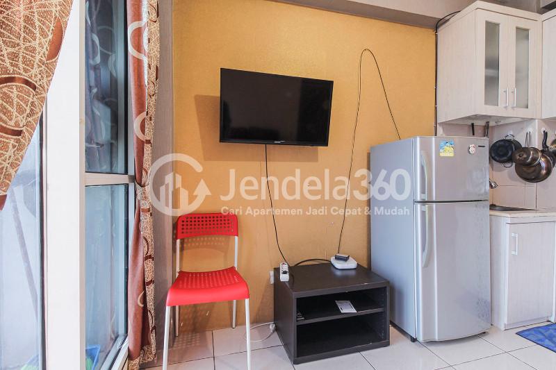 Living Room Cozy 2BR Apartment at Tifolia Apartment
