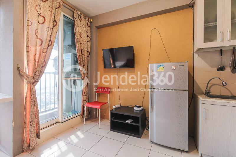 Living Room Cozy 2BR Apartment at Tifolia Apartment