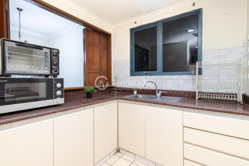 Kitchen Grand Tropic Suites Apartment 3BR Fully Furnished
