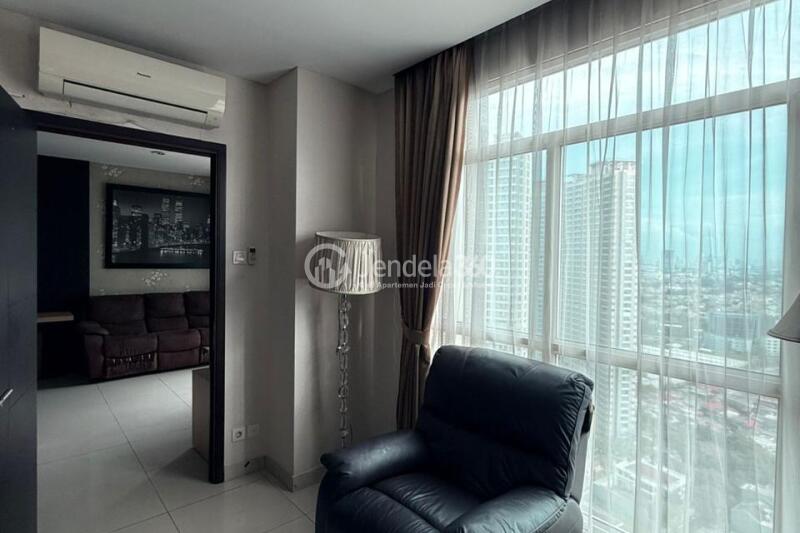 Living Room Homey 1BR Apartment High Floor with City View at Central Park Apartment
