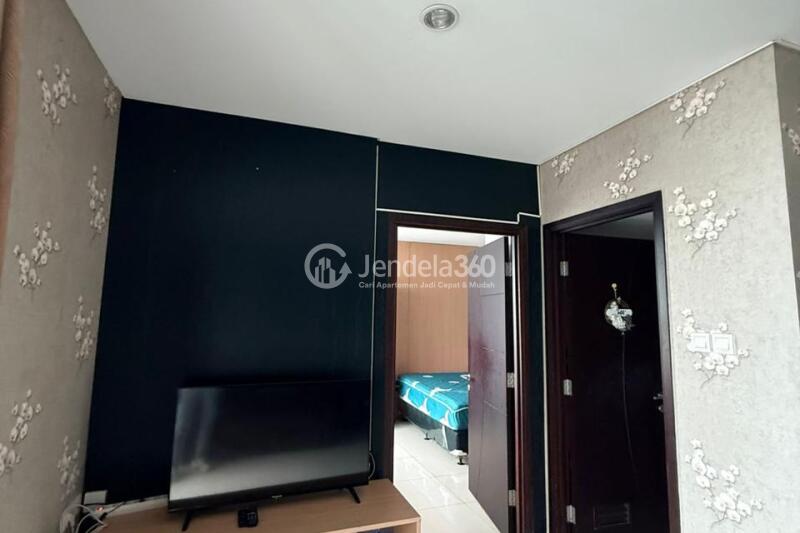 Living Room Homey 1BR Apartment High Floor with City View at Central Park Apartment