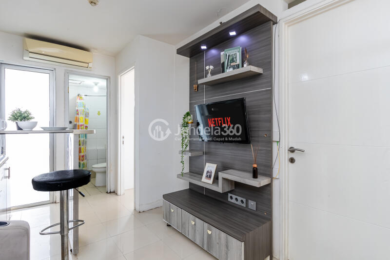 Living Room Cozy 2BR Apartment at Bassura City Apartment Close to McDonald's Duren Sawit