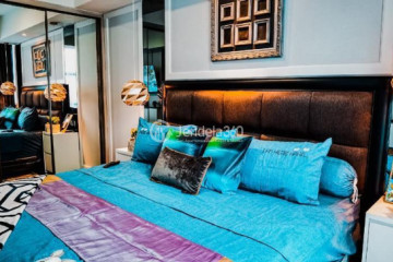 Bedroom 1 2BR Apartment with City View at Casa Grande Apartment