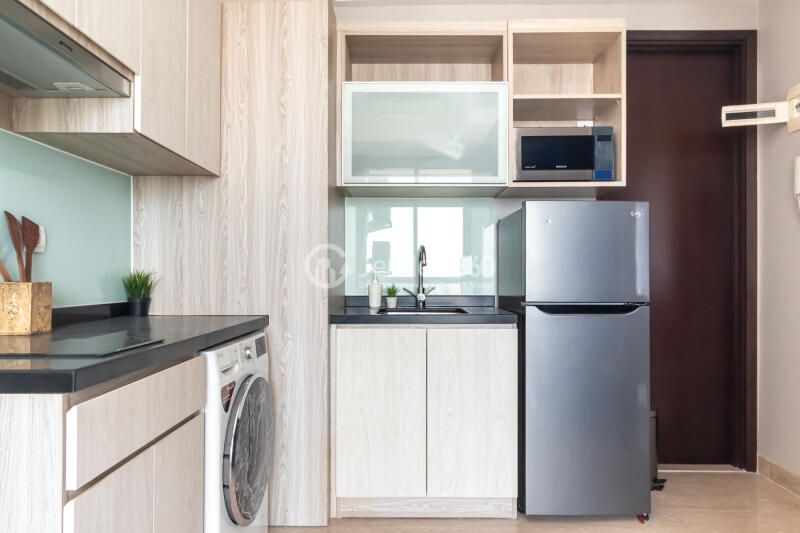 Kitchen High Floor 2BR Apartment with City View at Menteng Park