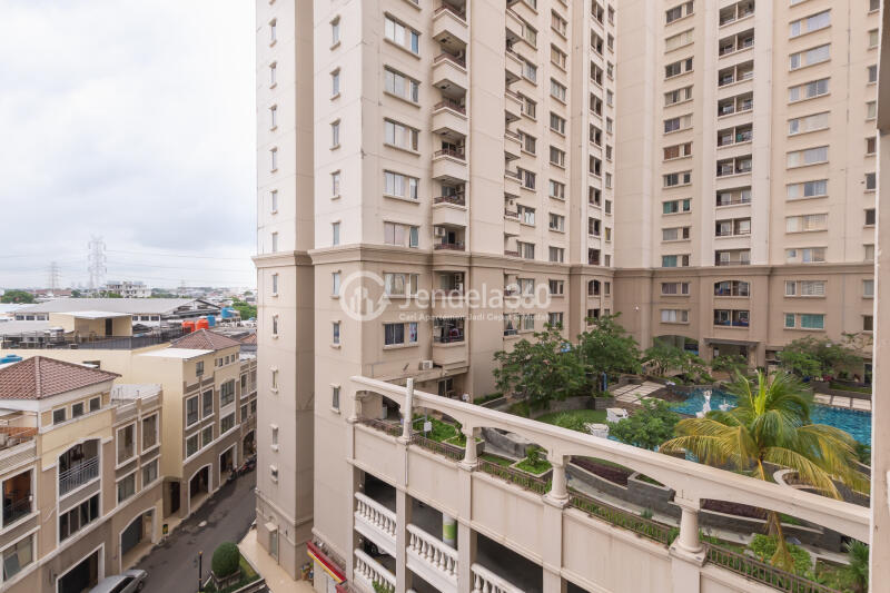 Balcony Cozy 1BR Apartment Near Kampung Bandan Station with City View at Mediterania Marina Ancol Apartment