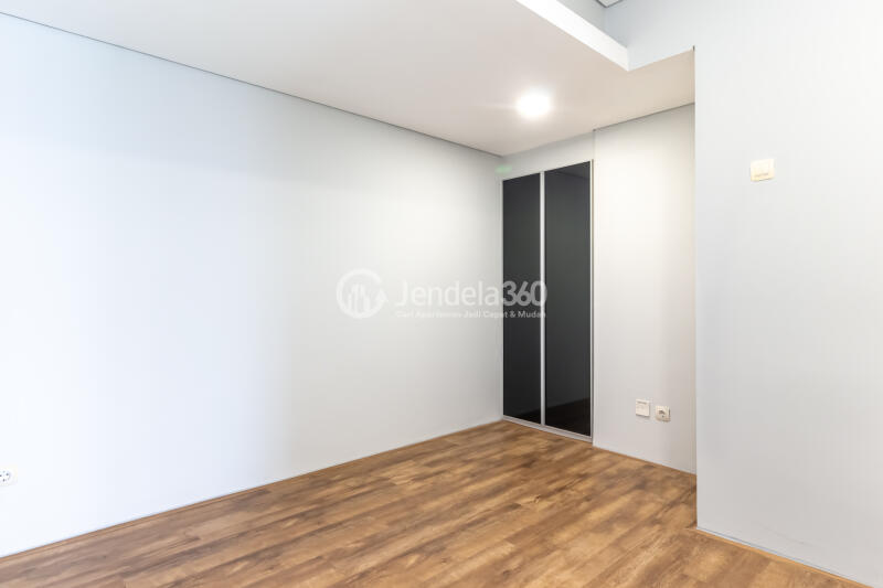Bedroom 2 Restful 2BR Apartment Middle Floor with City View at Maqna Residence