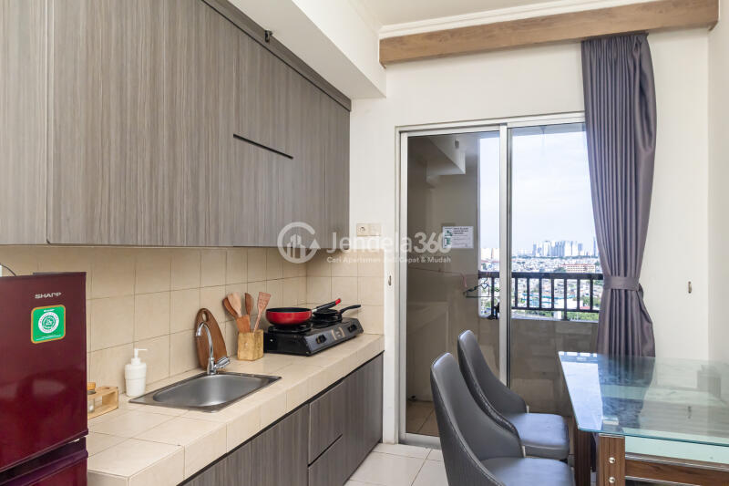 Kitchen 2BR Apartment with Glamourous Interior and City View at Mediterania Marina Ancol Apartment