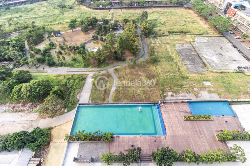 Balcony Fancy Studio Apartment Middle Floor with City View at Vasanta Innopark Apartment