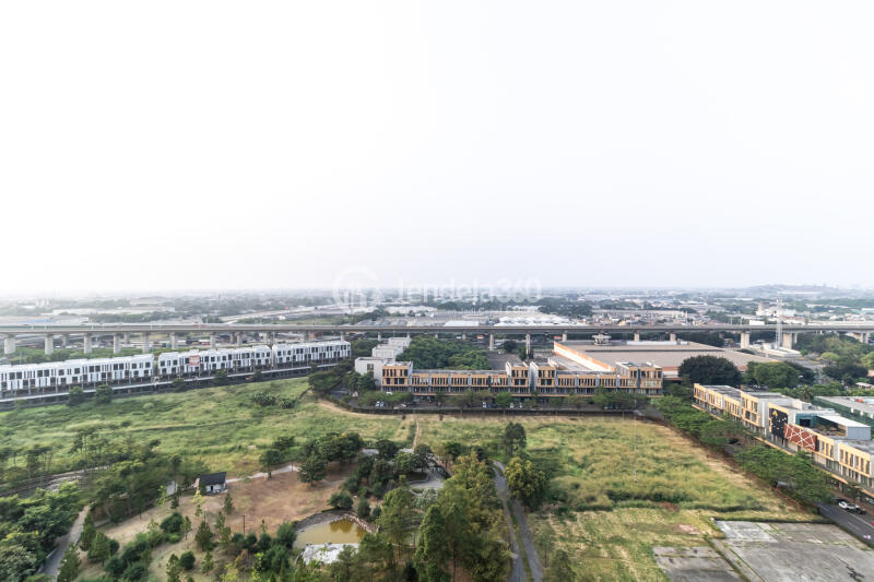 Balcony Fancy Studio Apartment Middle Floor with City View at Vasanta Innopark Apartment