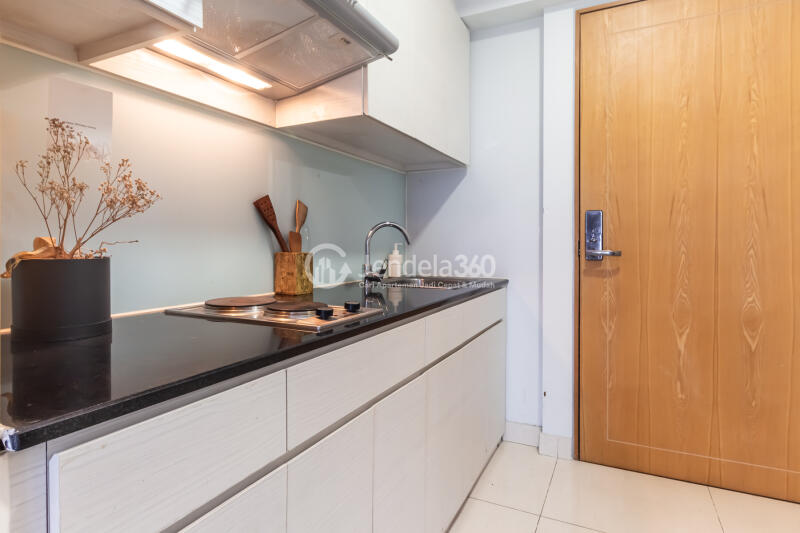 Kitchen Strategic Location 2BR Apartment Middle Floor with City View at Maqna Residence