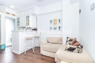 Living Room High Floor 2BR Apartment with  View at Green Pramuka City Apartment