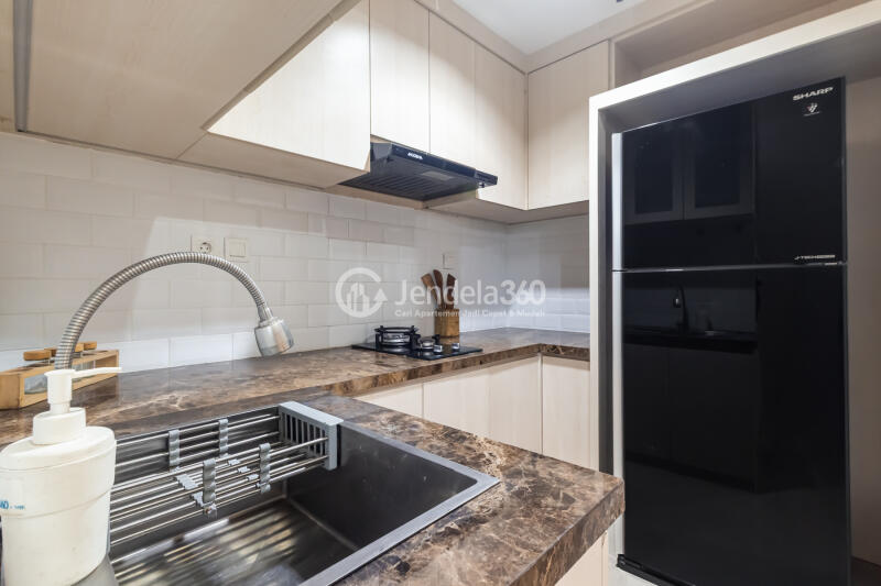 Kitchen 1BR Apartment with City View at Vasanta Innopark Apartment