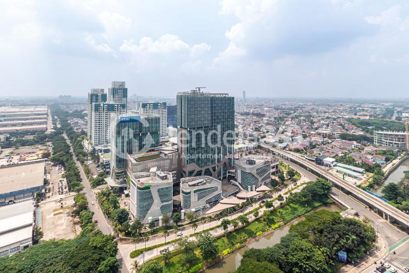 Balcony High Floor Studio Apartment with City View at Tifolia Apartment