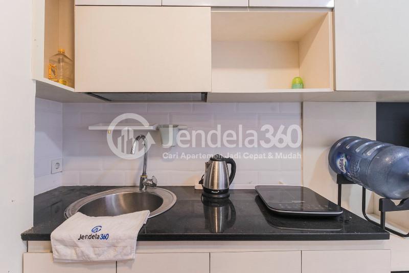 Kitchen Cozy Studio Apartment with Direct Access to Universitas Indonesia Train Station at Taman Melati Margonda Apartment