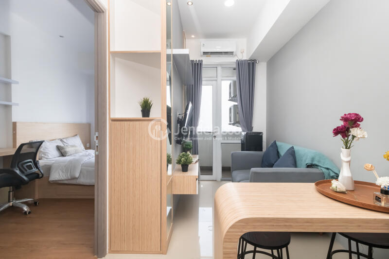 Living Room Strategic Location 1BR Apartment High Floor with City View at Vasanta Innopark Apartment