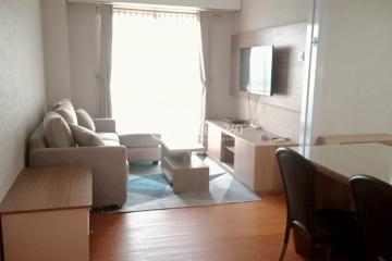 Living Room Modern 2BR Apartment at Trivium Terrace Tower South