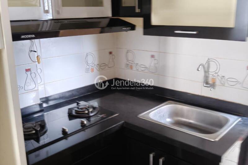 Kitchen Well Furnished 2BR Apartment Middle Floor with Swimming Pool View at The Suites @ Metro Bandung