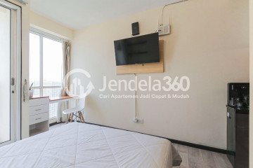 Bedroom High Floor Studio Apartment with Jakarta International Equestrian Park View at Tifolia Apartment