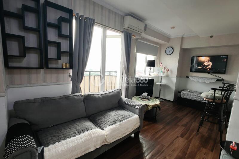 Living Room Peaceful 2BR Apartment at Mutiara Bekasi Apartment Middle Floor
