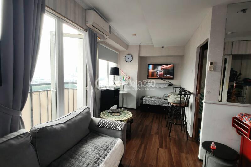 Living Room Peaceful 2BR Apartment at Mutiara Bekasi Apartment Middle Floor