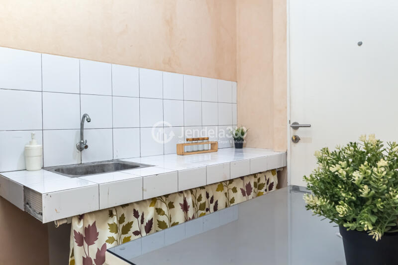 Kitchen Peaceful Studio Apartment Middle Floor with City View at Pakubuwono Terrace