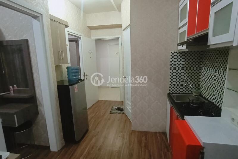 Living Room 2BR Green Pramuka City Apartment at Middle Floor
