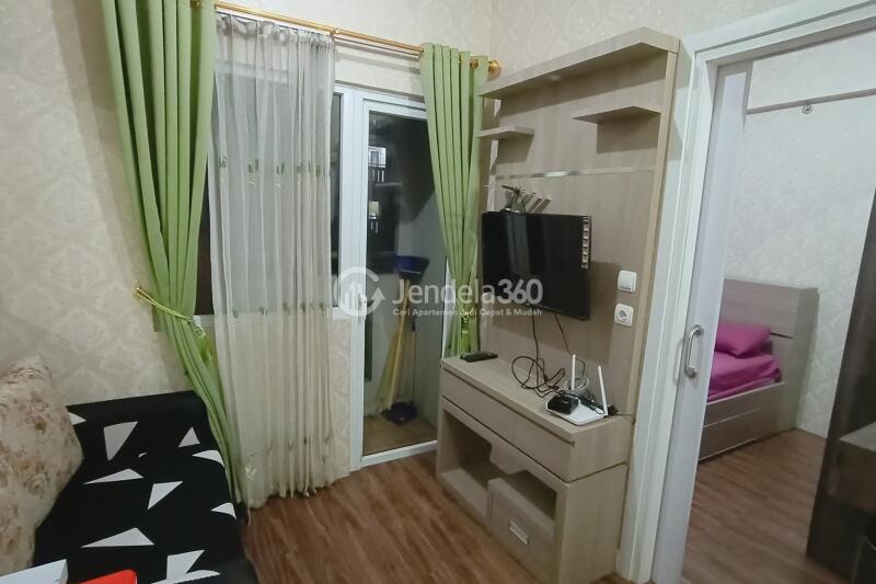 Living Room 2BR Green Pramuka City Apartment at Middle Floor