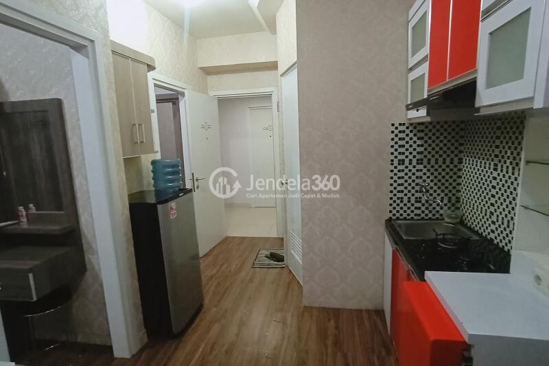 Living Room 2BR Green Pramuka City Apartment at Middle Floor