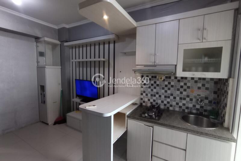 Kitchen 1BR Green Pramuka City Apartment at Low Floor