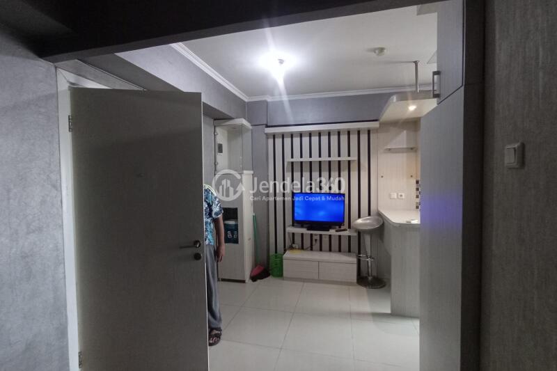 Living Room 1BR Green Pramuka City Apartment at Low Floor