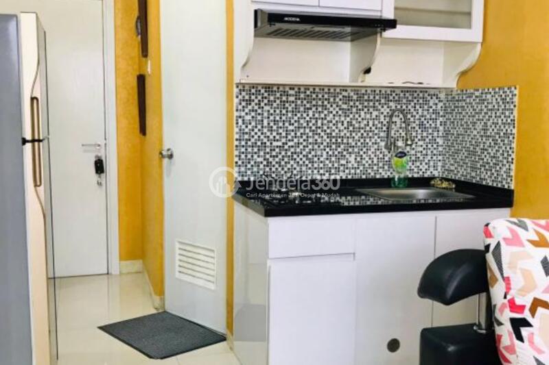 Kitchen 2BR Green Pramuka City Apartment at Middle Floor