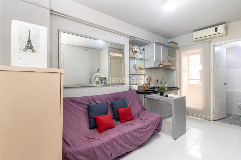 Living Room Trendy 2BR Apartment Low Floor with  View at Kalibata City Apartment