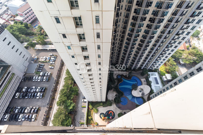 Balcony High Floor Studio Apartment with City View at Puri Orchard Apartment