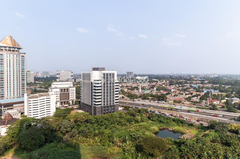 Balcony Decorative Studio Apartment Middle Floor with City View at Antasari Place Apartment