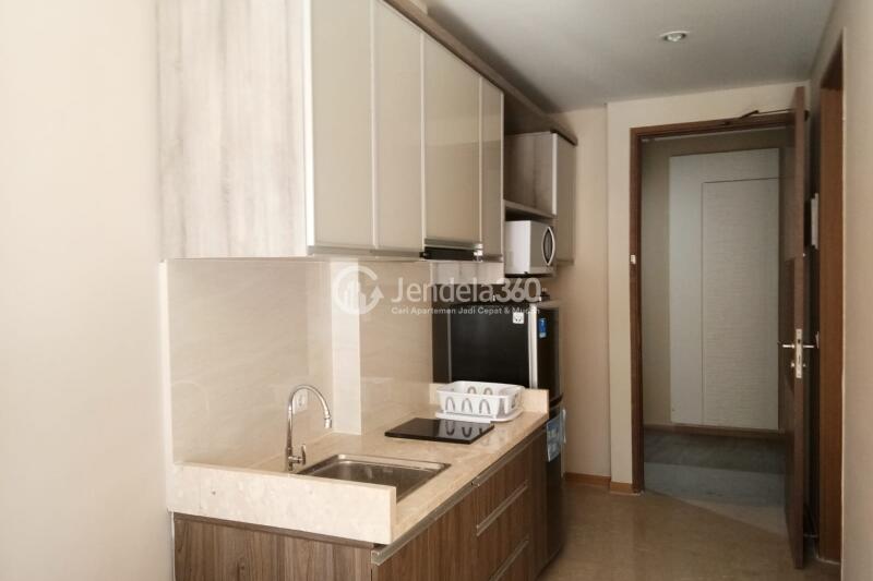 Kitchen 1BR Apartment with  View at Grande Valore Condominium