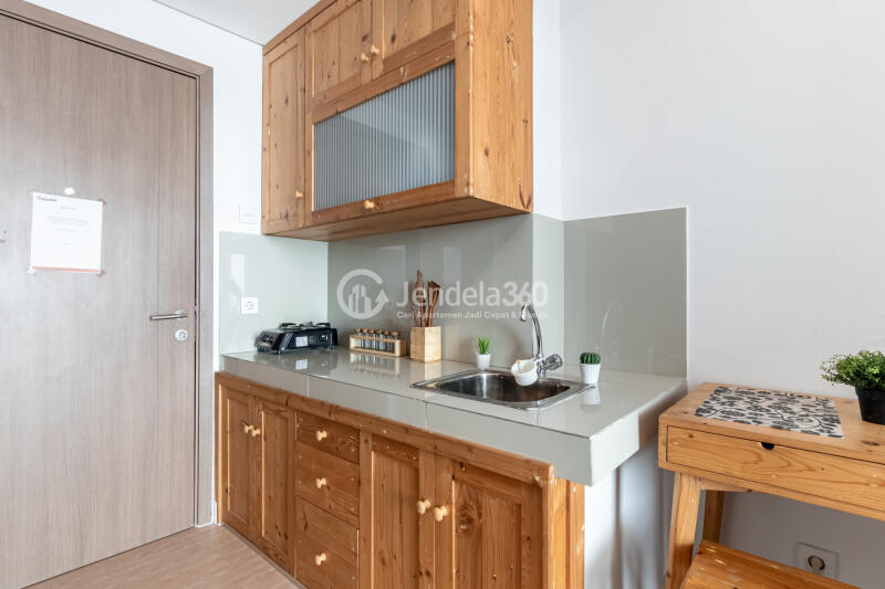 Kitchen Peaceful 1BR Apartment at Puri Orchard Apartment Low Floor
