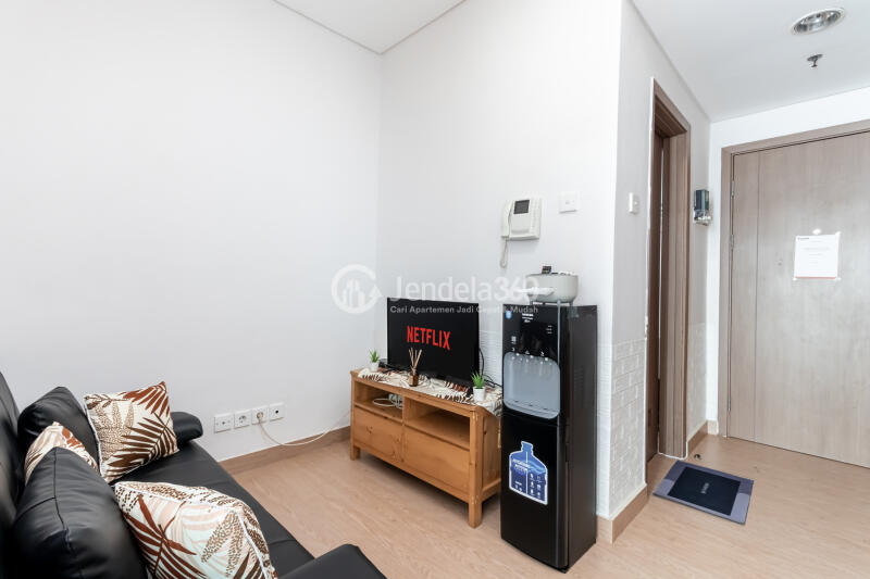 Living Room Peaceful 1BR Apartment at Puri Orchard Apartment Low Floor